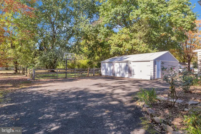a view of a big yard with large trees