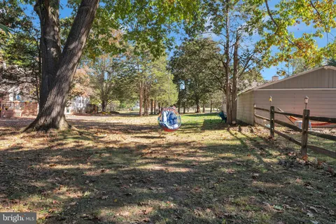 a view of outdoor space with deck and trees
