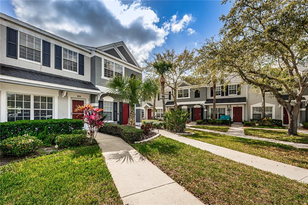 459 Countryside Key Boulevard Oldsmar, FL 34677 - Photo 1 of 1 a front view of a house with a yard table and chairs