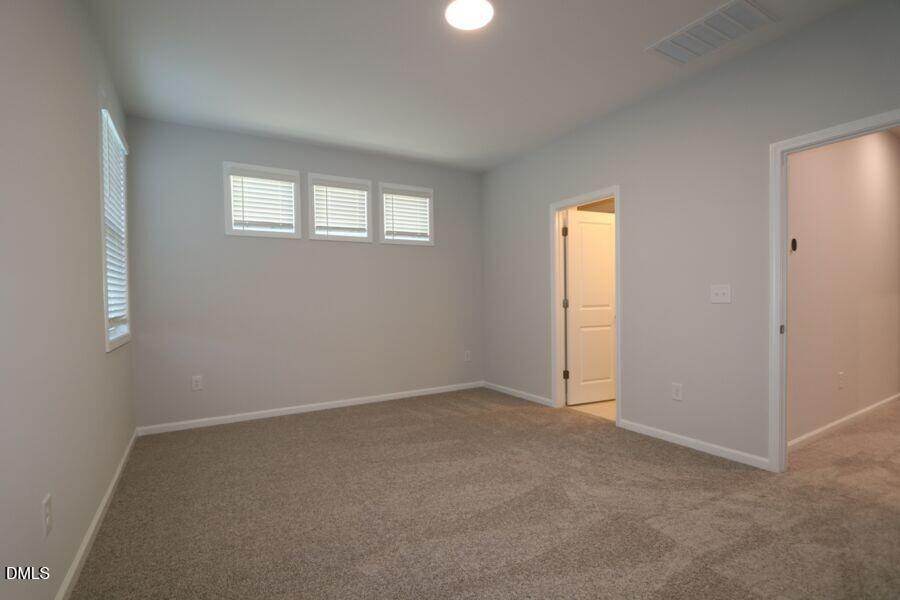 2913 Richardson Road, Unit 475 Apex, NC 27502 - Photo 15 of 24 an empty room with windows and closet