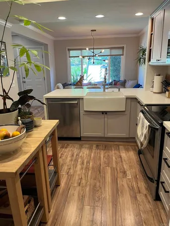 a kitchen with a sink appliances and cabinets