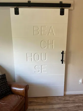 a view of a door with wooden floor