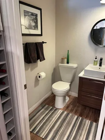 a bathroom with a toilet and a sink