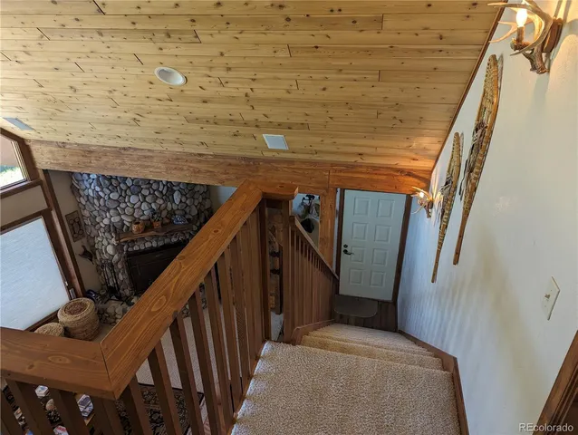 a bedroom with bed and a chandelier