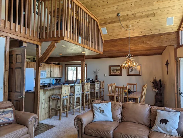 a kitchen with granite countertop a sink stove and cabinets