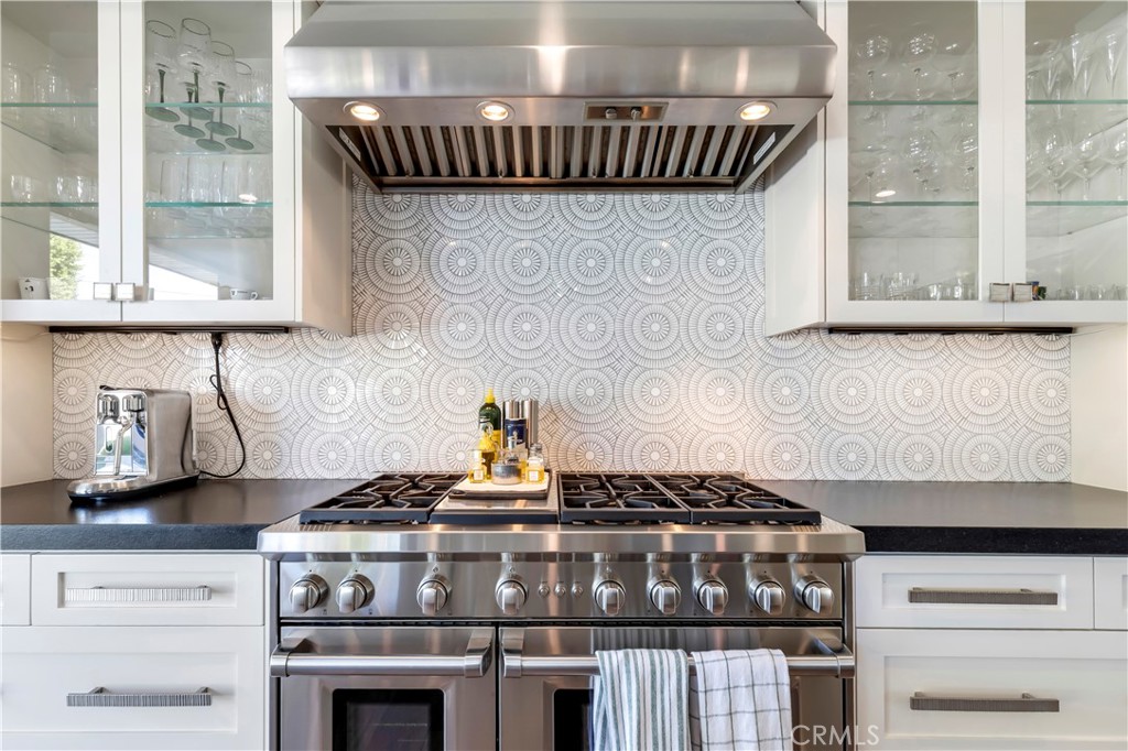 660 Kings Road Newport Beach, CA 92663 - Photo 8 of 41 a stove top oven sitting inside of a kitchen