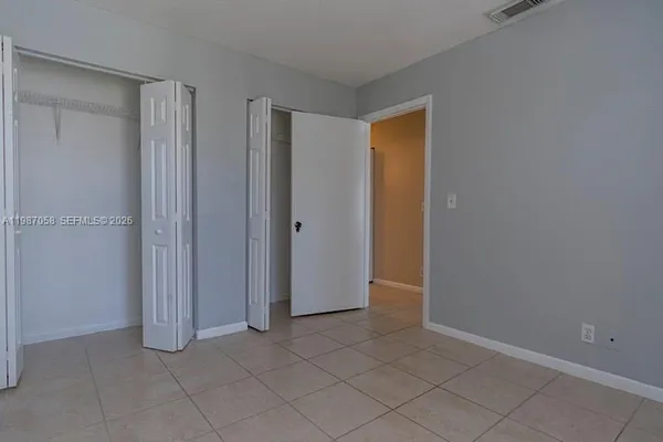 an empty room with entrance door
