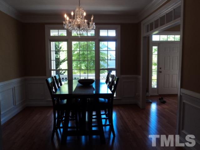 1108 Coram Fields Road Wake Forest, NC 27587 - Photo 3 of 24 a view of a dining room with furniture window and wooden floor