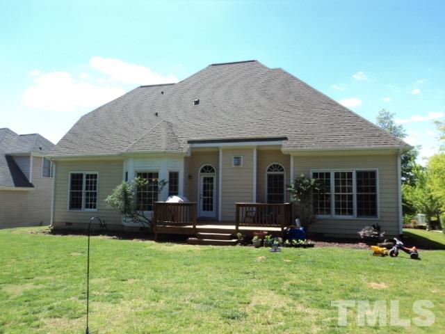 1108 Coram Fields Road Wake Forest, NC 27587 - Photo 21 of 24 a view of a house with backyard porch and a small cabin