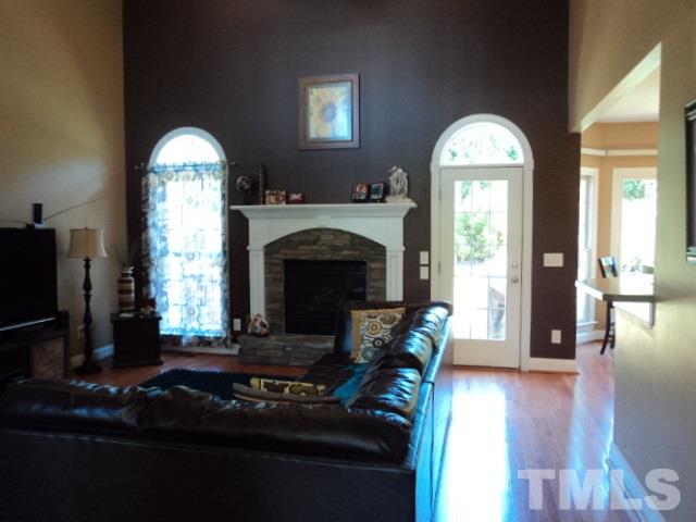 1108 Coram Fields Road Wake Forest, NC 27587 - Photo 4 of 24 a living room with furniture fireplace and flat screen tv