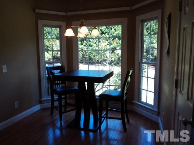 1108 Coram Fields Road Wake Forest, NC 27587 - Photo 9 of 24 a view of a dining room with furniture and window