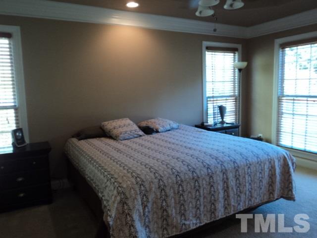 1108 Coram Fields Road Wake Forest, NC 27587 - Photo 10 of 24 a bedroom with a bed and window