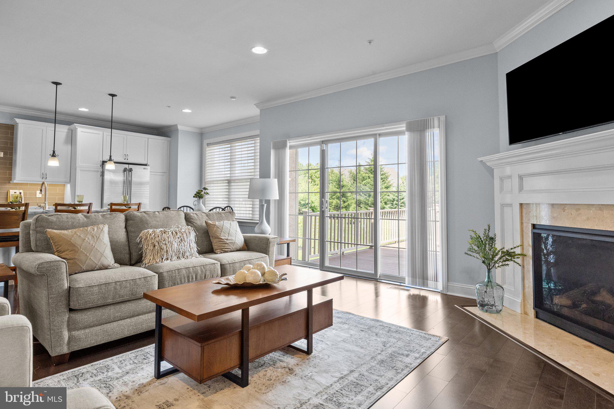 23 David Drive Newtown, PA 18940 - Photo 17 of 44 a living room with furniture a flat screen tv and a fireplace