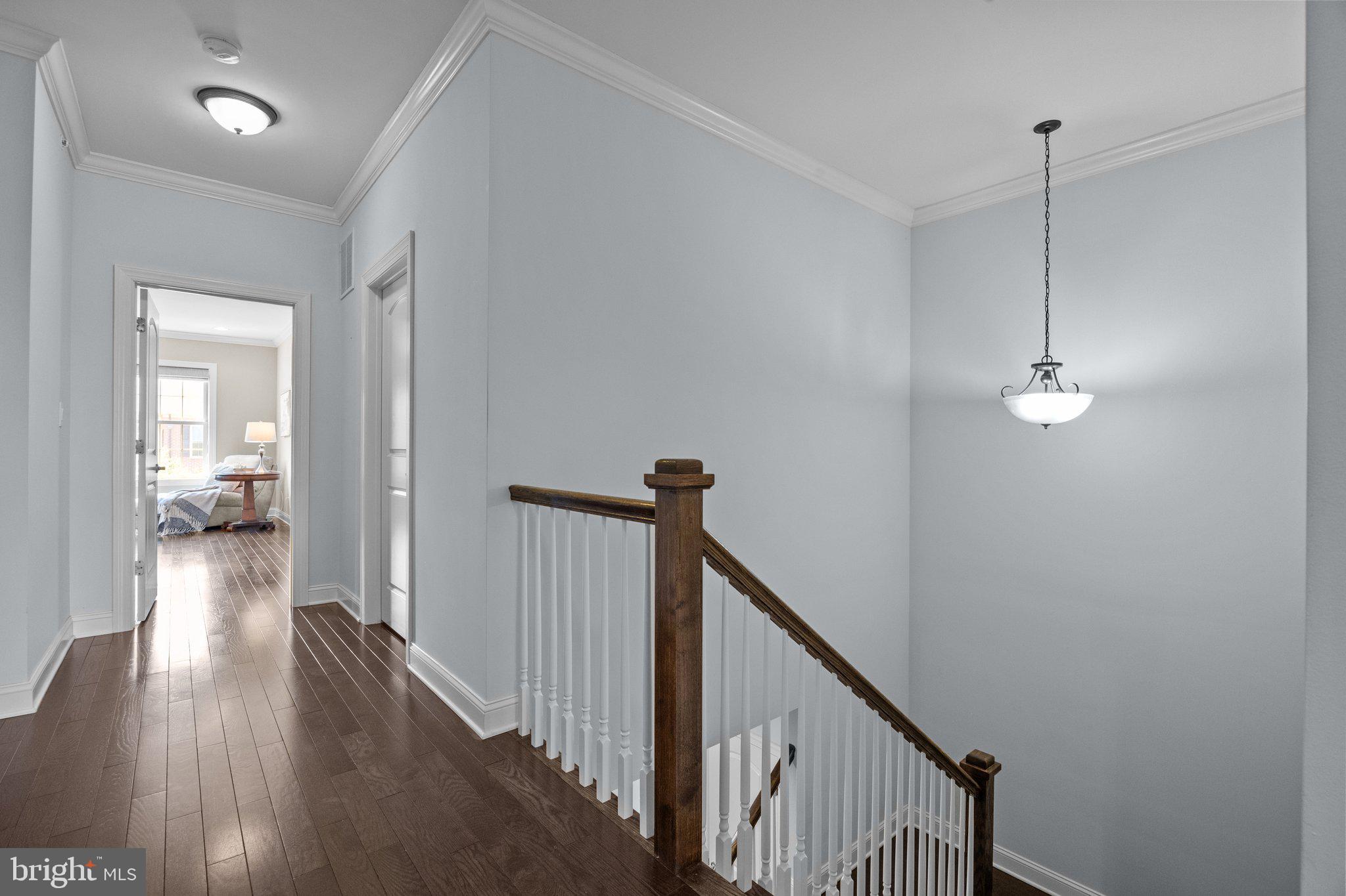 23 David Drive Newtown, PA 18940 - Photo 21 of 44 a view of a hallway view with wooden floor and staircase