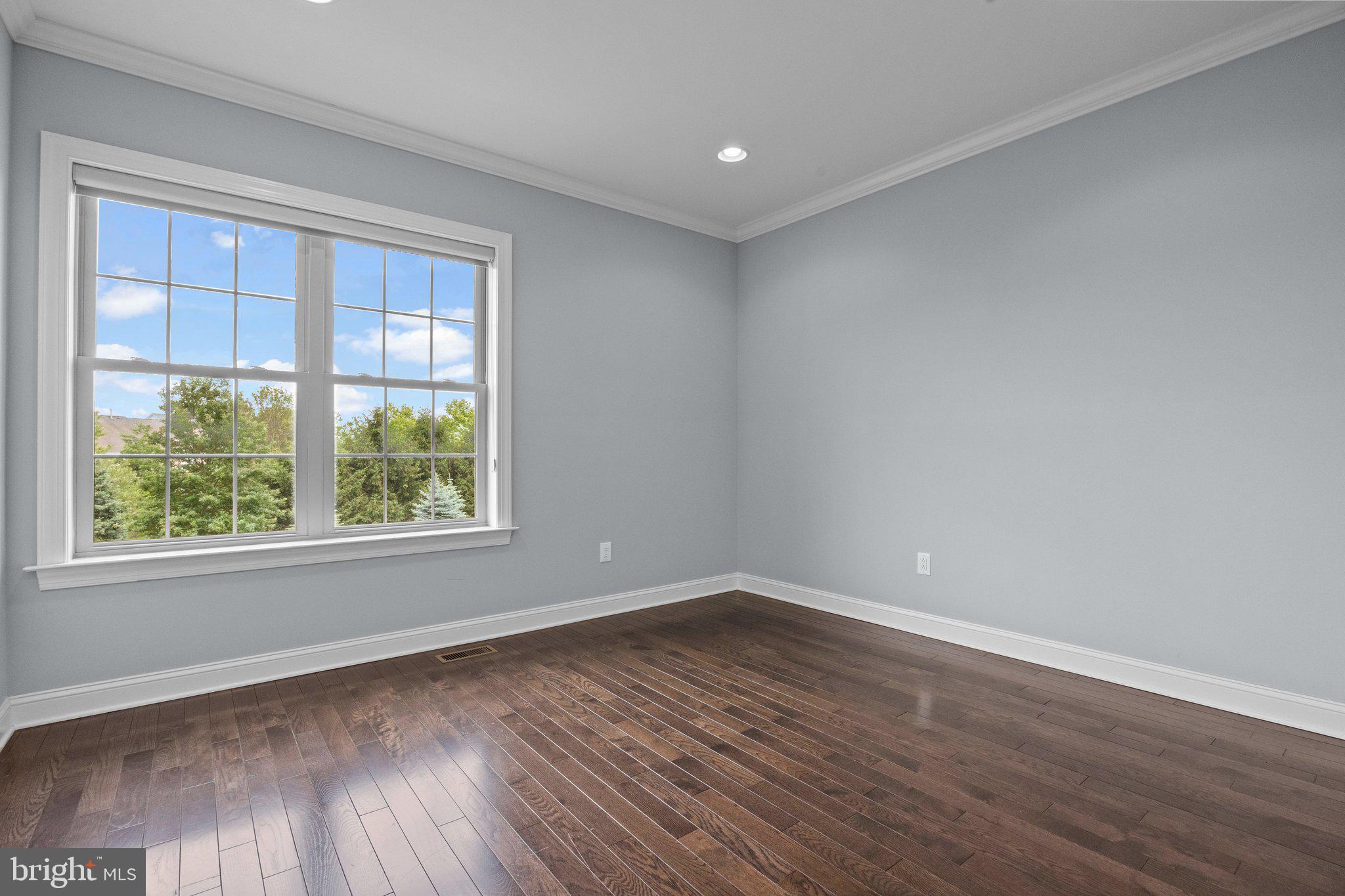 23 David Drive Newtown, PA 18940 - Photo 35 of 44 a view of empty room with wooden floor and fan