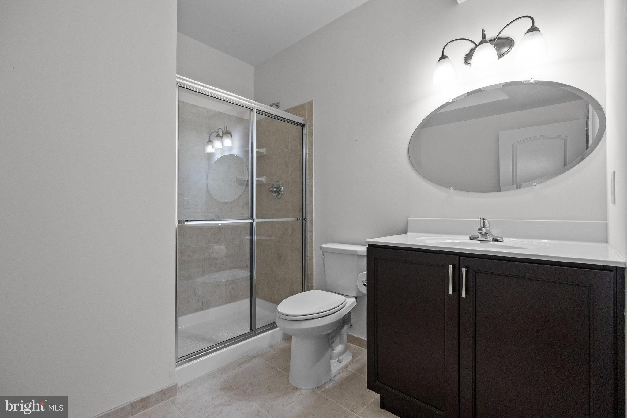 23 David Drive Newtown, PA 18940 - Photo 39 of 44 a bathroom with a toilet a sink and mirror