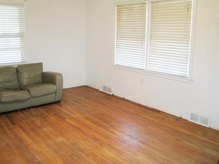 1003 16th Street Ralls, TX 79357 - Photo 2 of 9 a view of livingroom with furniture and window