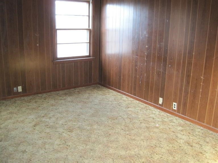 1003 16th Street Ralls, TX 79357 - Photo 6 of 9 an empty room with windows