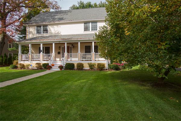 37 Beechwood Road Wellesley, MA 02482 - Photo 1 of 24 a front view of a house with a yard and trees