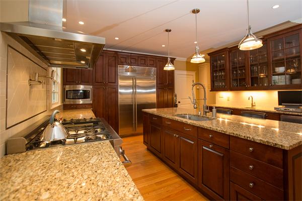 37 Beechwood Road Wellesley, MA 02482 - Photo 11 of 24 a large kitchen with kitchen island granite countertop a sink and a stove
