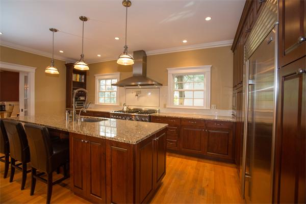 37 Beechwood Road Wellesley, MA 02482 - Photo 13 of 24 a large kitchen with kitchen island a large island in it