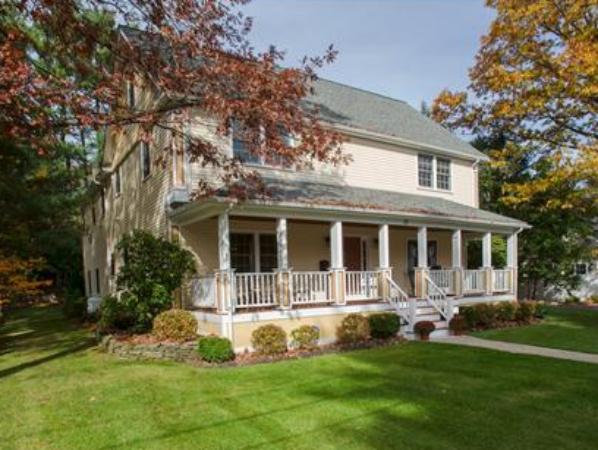 37 Beechwood Road Wellesley, MA 02482 - Photo 2 of 24 a front view of a house with a yard table and chairs