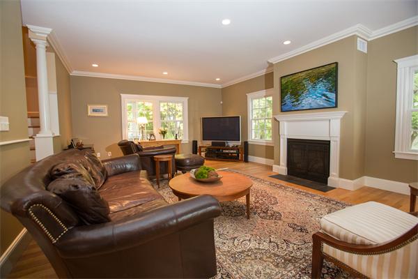 37 Beechwood Road Wellesley, MA 02482 - Photo 6 of 24 a living room with furniture a flat screen tv and a fireplace