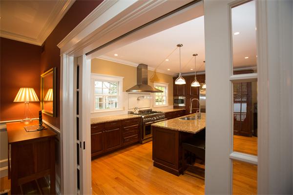 37 Beechwood Road Wellesley, MA 02482 - Photo 9 of 24 a kitchen with granite countertop kitchen island granite countertop wooden cabinets and stainless steel appliances