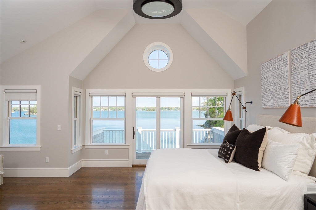 151 Downer Avenue Hingham, MA 02043 - Photo 12 of 19 a bedroom with a bed and a large window