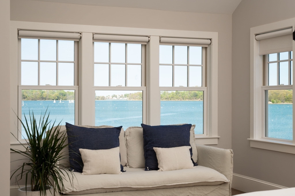 151 Downer Avenue Hingham, MA 02043 - Photo 13 of 19 a living room with furniture and large windows