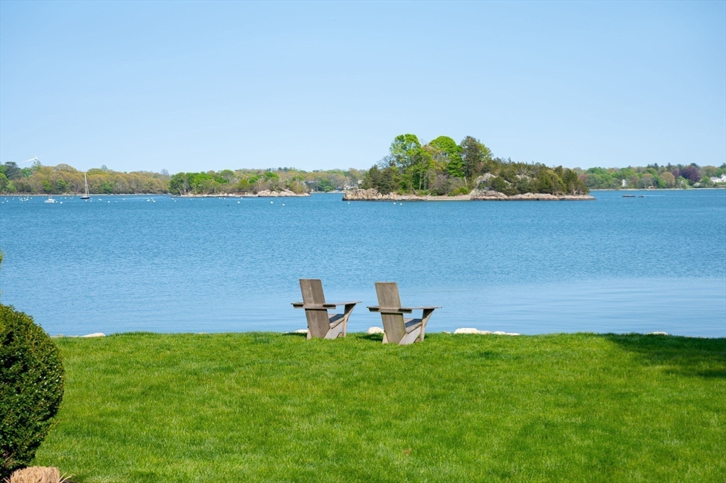 151 Downer Avenue Hingham, MA 02043 - Photo 17 of 19 a view of a lake with outdoor space and a bench