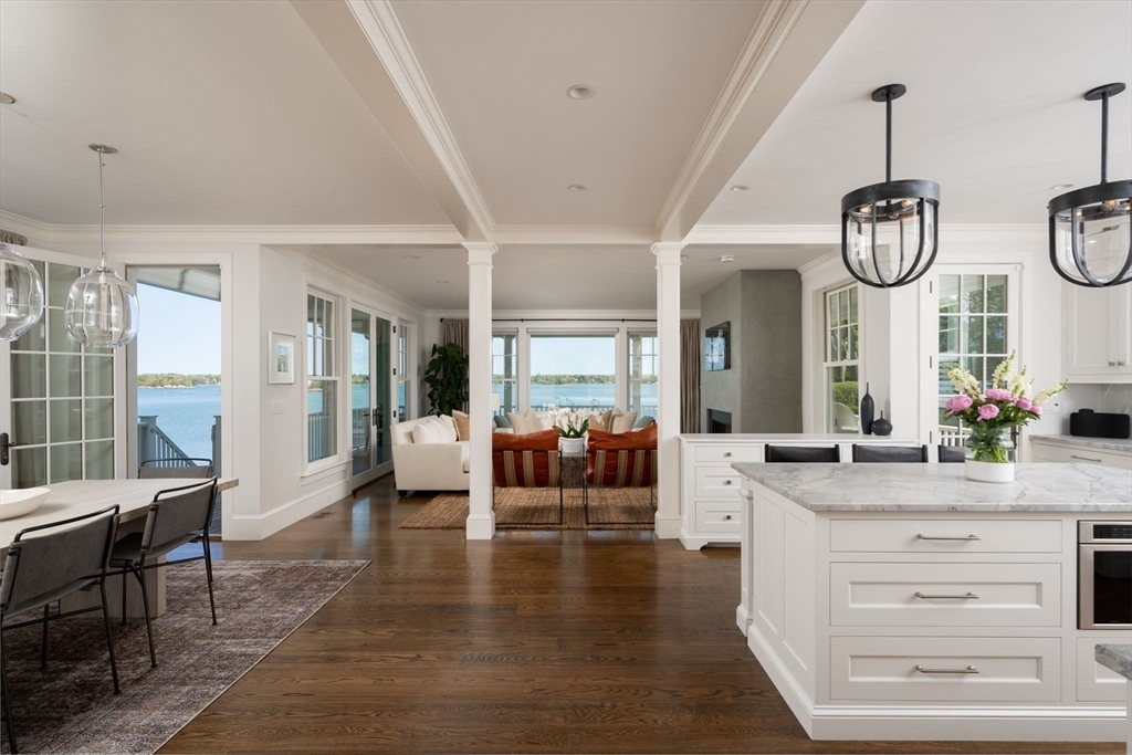 151 Downer Avenue Hingham, MA 02043 - Photo 3 of 19 a living room with couches a dining table chairs and couches with wooden floor