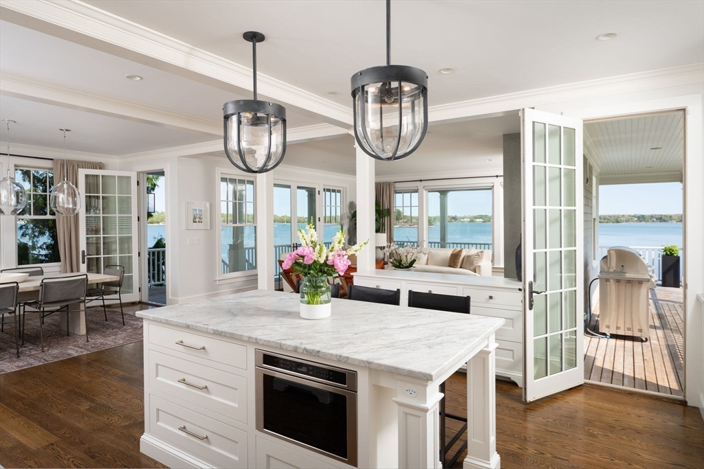 151 Downer Avenue Hingham, MA 02043 - Photo 4 of 19 a kitchen with a counter space a sink appliances and cabinets