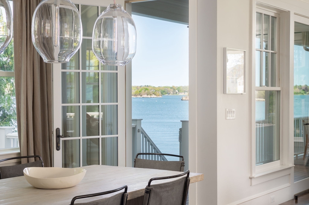 151 Downer Avenue Hingham, MA 02043 - Photo 9 of 19 a view of a livingroom with furniture and windows