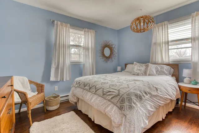 a bedroom with a bed and chair