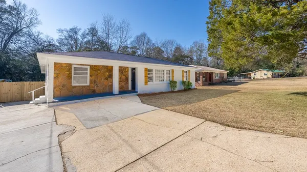 front view of a house with a yard
