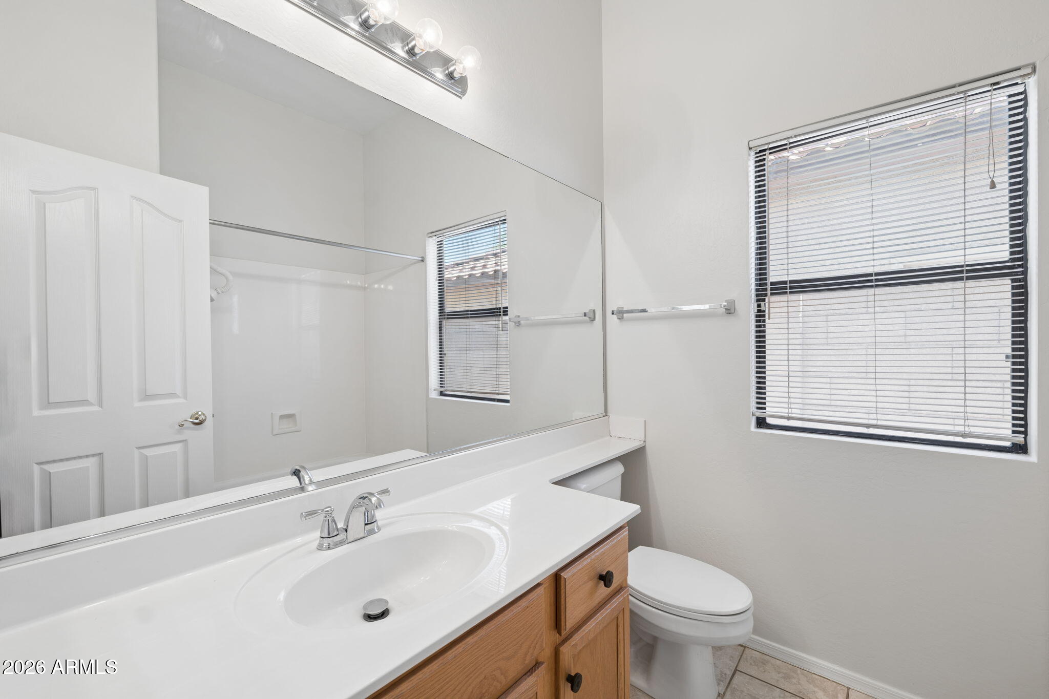 4418 East Jaeger Road Phoenix, AZ 85050 - Photo 26 of 42 a bathroom with a sink toilet and shower