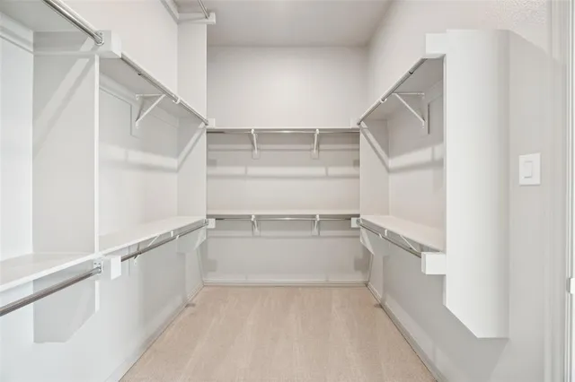 an empty room with windows and entrance