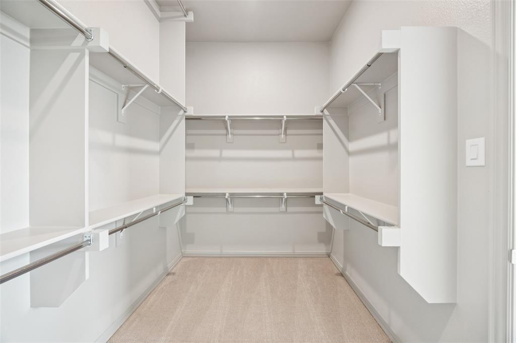 1023 Magdalena Way Midlothian, TX 76065 - Photo 9 of 16 Featuring ample space and 3rd row seasonal hanging space, this owner's closet offers outstanding room for all your personal treasures!