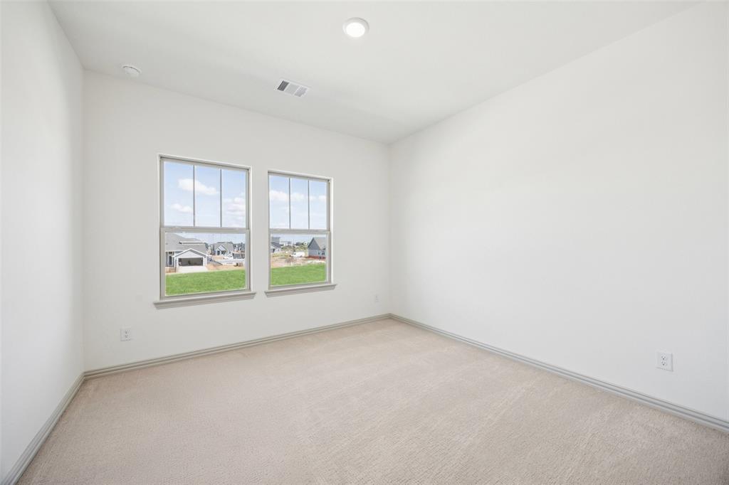 1023 Magdalena Way Midlothian, TX 76065 - Photo 16 of 16 You'll find nicely sized secondary bedrooms in our Emily floor plan.