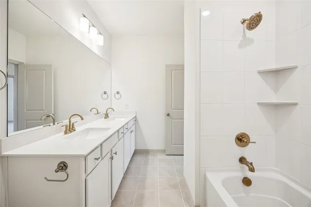 a spacious bathroom with a granite countertop sink mirror and double