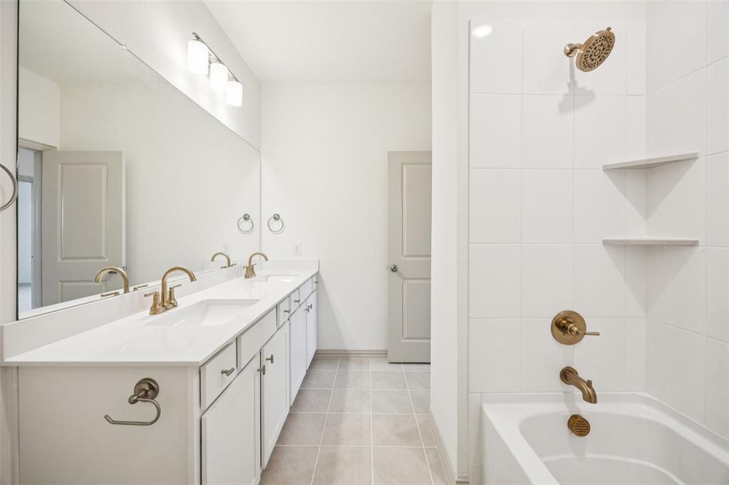 1023 Magdalena Way Midlothian, TX 76065 - Photo 10 of 16 Guests will feel right at home in this beautifully finished guest bath featuring vanity space for two!