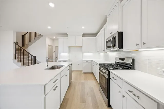 a bathroom with a double vanity sink and a bathtub