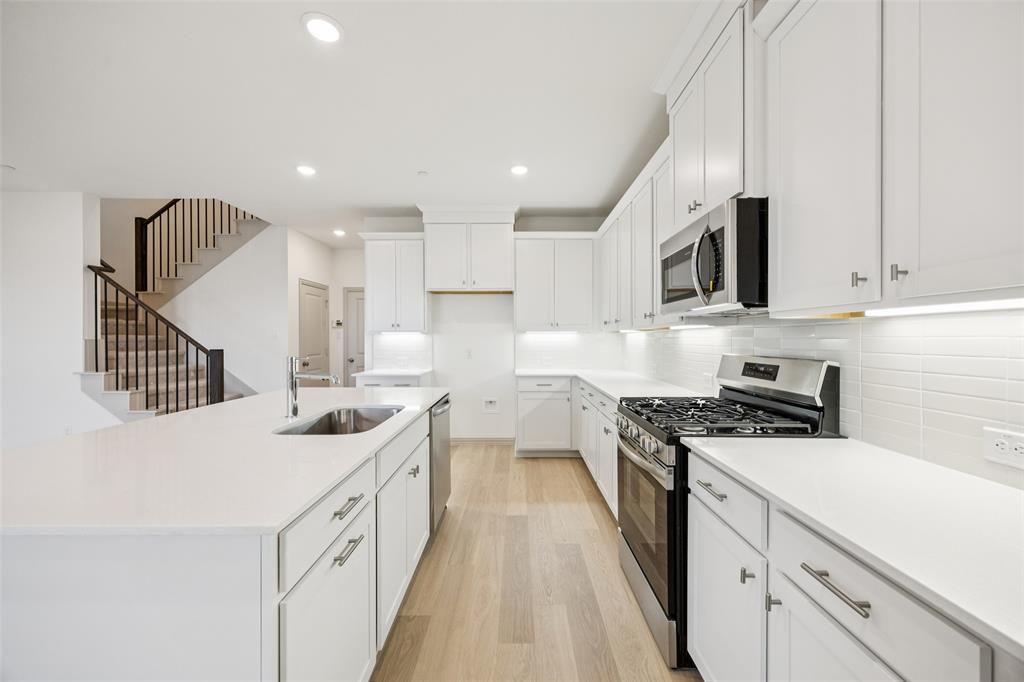 1023 Magdalena Way Midlothian, TX 76065 - Photo 14 of 16 Our Emily floor plan offers a kitchen any chef would be proud to call their own!