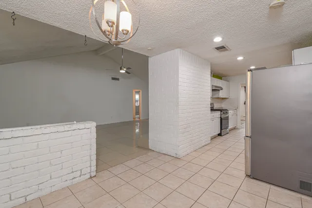 a view of a room with closet and ceiling fan