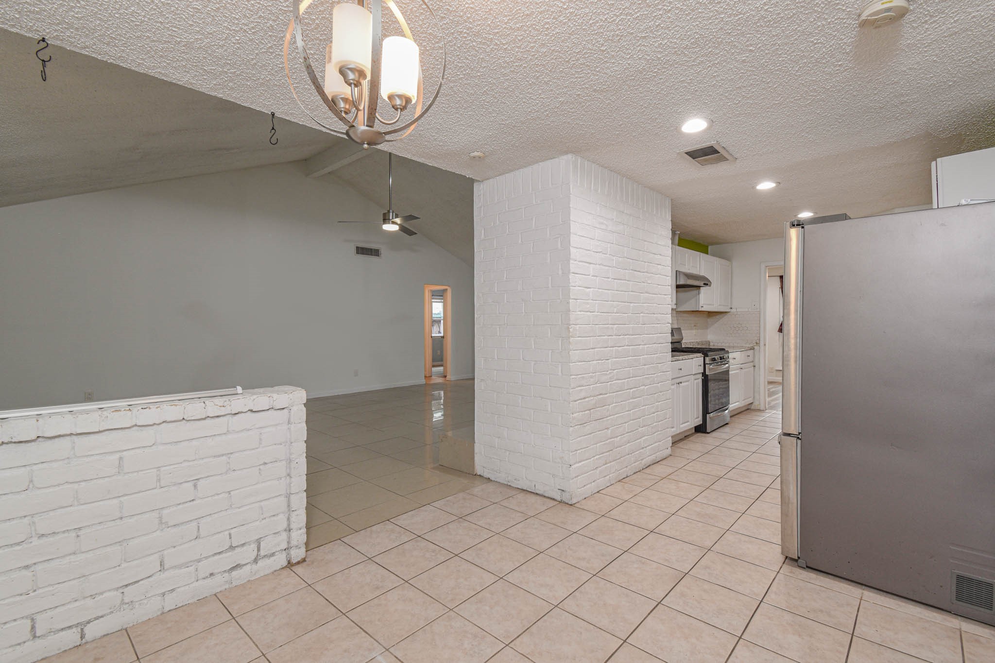12054 Plumpoint Drive Houston, TX 77099 - Photo 11 of 24 a view of cabinets with stainless steel appliances wooden floor and a kitchen