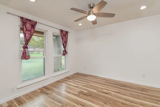 a view of a room with a large window