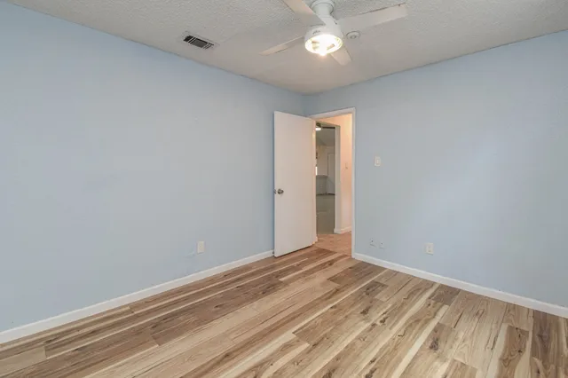 a view of room with closet and windows