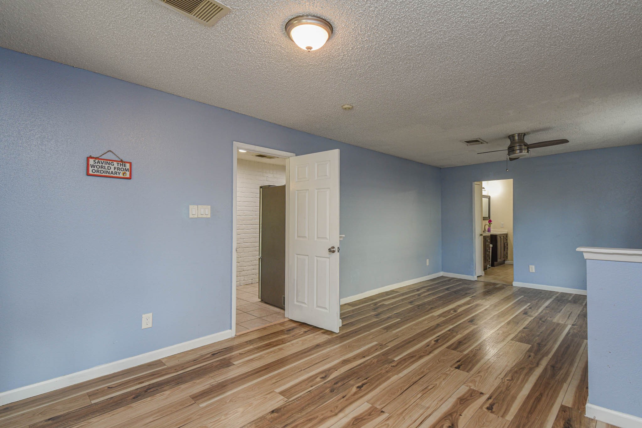 12054 Plumpoint Drive Houston, TX 77099 - Photo 19 of 24 wooden floor in an empty room with a window
