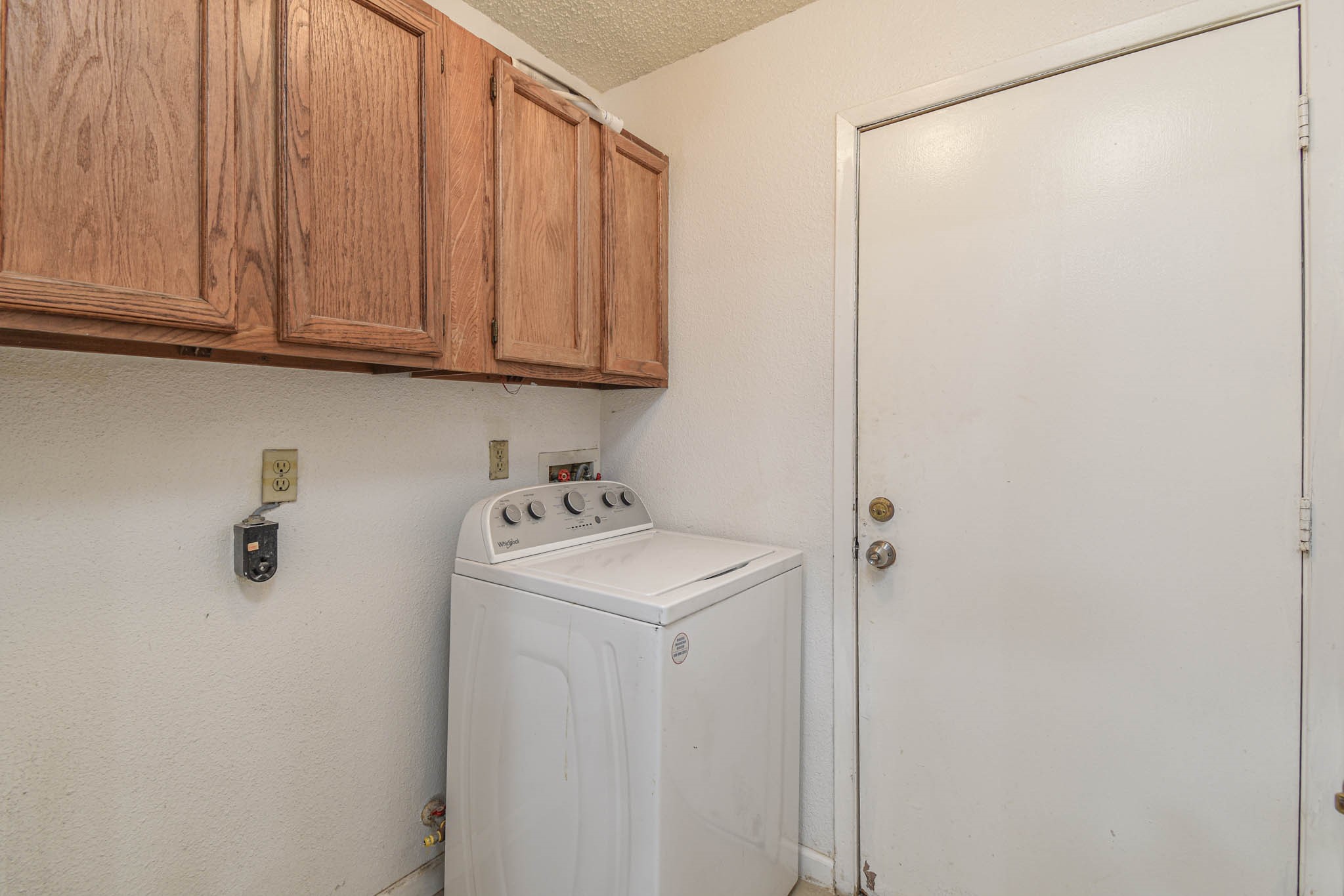 12054 Plumpoint Drive Houston, TX 77099 - Photo 24 of 24 a utility room with dryer and washer